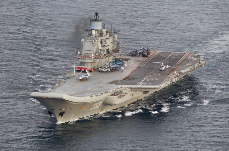 This October 17, 2016 Norwegian Armed Forces handout image shows the Russian aircraft carrier Admiral Kuznetsov passing the Norwegian island of Andoya in international waters on its way to the mediterranean. The Admiral Kuznetsov aircraft carrier the nuclear powered battleship Pyotr Velikiy and six other vessels were photographed by Norway' s Lockheed P-3 Orion surveillance aircraft. / AFP PHOTO / forsvaret / STR / RESTRICTED TO EDITORIAL USE - MANDATORY CREDIT "AFP PHOTO / Forsvaret " - NO MARKETING - NO ADVERTISING CAMPAIGNS - DISTRIBUTED AS A SERVICE TO CLIENTS