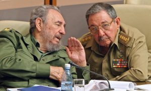 (FILES) This file photo taken on December 23, 2003 shows Cuban President Fidel Castro (L) and his brother Raul, Minister of the Revoutionary Armed Forces, chat in Havana, during the last meeting of the Cuban Parliament. Cuban revolutionary icon Fidel Castro died late on November 25, 2016 in Havana, his brother, President Raul Castro, announced on national television. / AFP PHOTO / ADALBERTO ROQUE