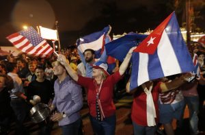 Cuban Americans celebrate upon hearing about the death of longtime Cuban leader Fidel Castro in the Little Havana neighborhood of Miami, Florida on November 26, 2016. Cuba's socialist icon and father of his country's revolution Fidel Castro died on November 25 aged 90, after defying the US during a half-century of ironclad rule and surviving the eclipse of global communism. / AFP PHOTO