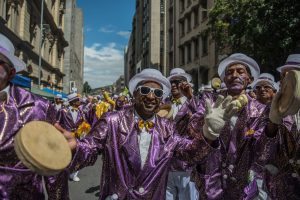 Hundreds of Cape Minstrels from different troops perform during the traditional Second New Year Parade on January 2, 2017 in the streets of central Cape Town, South Africa. The Kaapse Klopse (or simply Klopse) is a minstrel festival that takes place annually on 2 January and it is also referred to as Tweede Nuwe jaar (Second New Year), in Cape Town, South Africa. As many as 13,000 minstrels take to the streets garbed in bright colours, either carrying colourful umbrellas or playing an array of musical instruments. / AFP PHOTO / Mujahid SAFODIEN