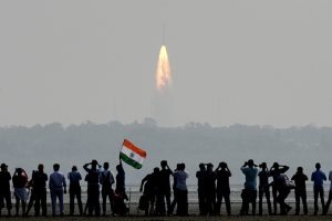 Indian onlookers watch the launch of the Indian Space Research Organisation (ISRO) Polar Satellite Launch Vehicle (PSLV-C37) at Sriharikota on Febuary 15, 2017. India successfully put a record 104 satellites from a single rocket into orbit on February 15 in the latest triumph for its famously frugal space agency. Scientists who were at the launch in the southern spaceport of Sriharikota burst into applause as the head of India's Space Research Organisation (ISRO) announced all the satellites had been ejected. / AFP PHOTO / ARUN SANKAR