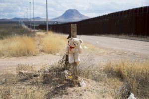 A teddy bear is tied to a post with barbed wire next tot he border fence in Douglas, Arizona, on February 18, 2017, on the US/Mexico border. Attention Editors, this image is part of an ongoing AFP photo project documenting the life on the two sides of the US/Mexico border simultaneously by two photographers traveling for ten days from California to Texas on the US side and from Baja California to Tamaulipas on the Mexican side between February 13 and 22, 2017. You can find all the images with the keyword : BORDERPROJECT2017 on our wire and on www.afpforum.com / AFP PHOTO / JIM WATSON