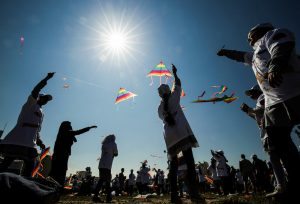 Palestinian school children fly kites in a show of solidarity with the Japanese people during an event organised by the United Nations Relief and Works Agency (UNRWA) marking the sixth anniversary of the Tohoku earthquake and tsunami that left more than 18,500 people dead or missing, in the southern Gaza Strip town of Khan Yunis on March 5, 2017. / AFP PHOTO / SAID KHATIB