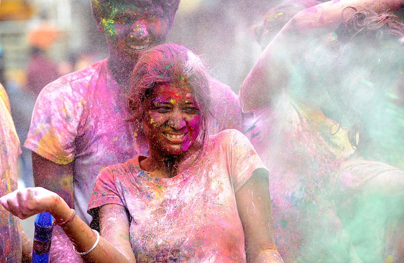 Indian revellers play with colours during Holi celebrations in Chennai on March 13, 2017. The Hindu festival of Holi, or the 'Festival of Colours' heralds the arrival of spring and the end of winter. / AFP PHOTO / ARUN SANKAR