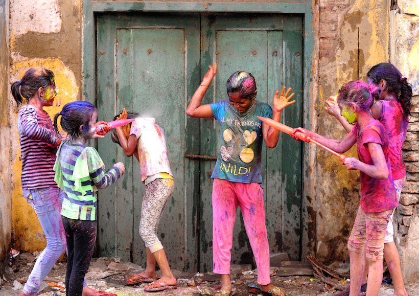 Indian revellers play with colours during Holi celebrations in Chennai on March 13, 2017. The Hindu festival of Holi, or the 'Festival of Colours' heralds the arrival of spring and the end of winter. / AFP PHOTO / ARUN SANKAR