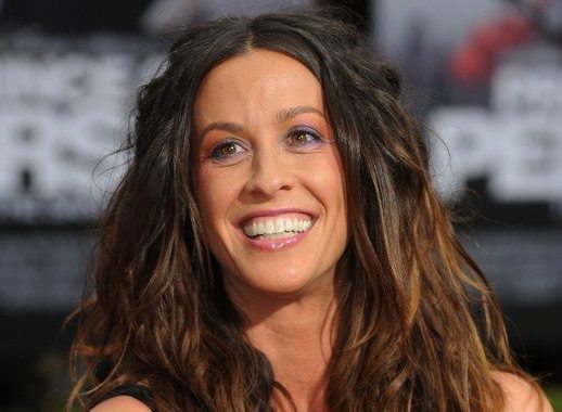 Musician Alanis Morissette poses on the red carpet as she arrives for the premiere of "Prince of Persia: The Sands of Time" at Grauman's Chinese Theater in Hollywood on April 17, 2010. The film is an action-adventure set in the mystical lands of Persia. A rogue prince (Jake Gyllenhaal) reluctantly joins forces with a mysterious princess (Gemma Arterton) and together, they race against dark forces to safeguard an ancient dagger capable of releasing the Sands of Timea gift from the gods that can reverse time and allow its possessor to rule the world. AFP PHOTO/Mark RALSTON / AFP PHOTO / MARK RALSTON