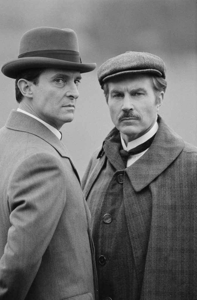 English actors Jeremy Brett (1933 - 1995) and David Burke (right) star in the television series 'The Adventures of Sherlock Holmes', UK, 7th March 1984. (Photo by Paul Massey/Express/Getty Images)