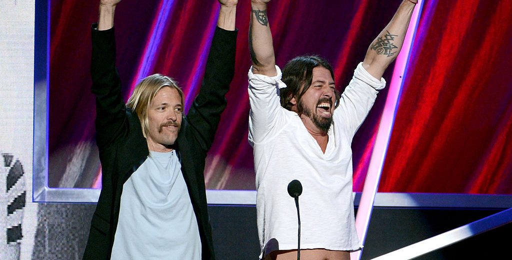 LOS ANGELES, CA - APRIL 18: (L-R) Presenters Taylor Hawkins and Dave Grohl of Foo Fighters speak onstage at the 28th Annual Rock and Roll Hall of Fame Induction Ceremony at Nokia Theatre L.A. Live on April 18, 2013 in Los Angeles, California. (Photo by Kevin Winter/Getty Images)