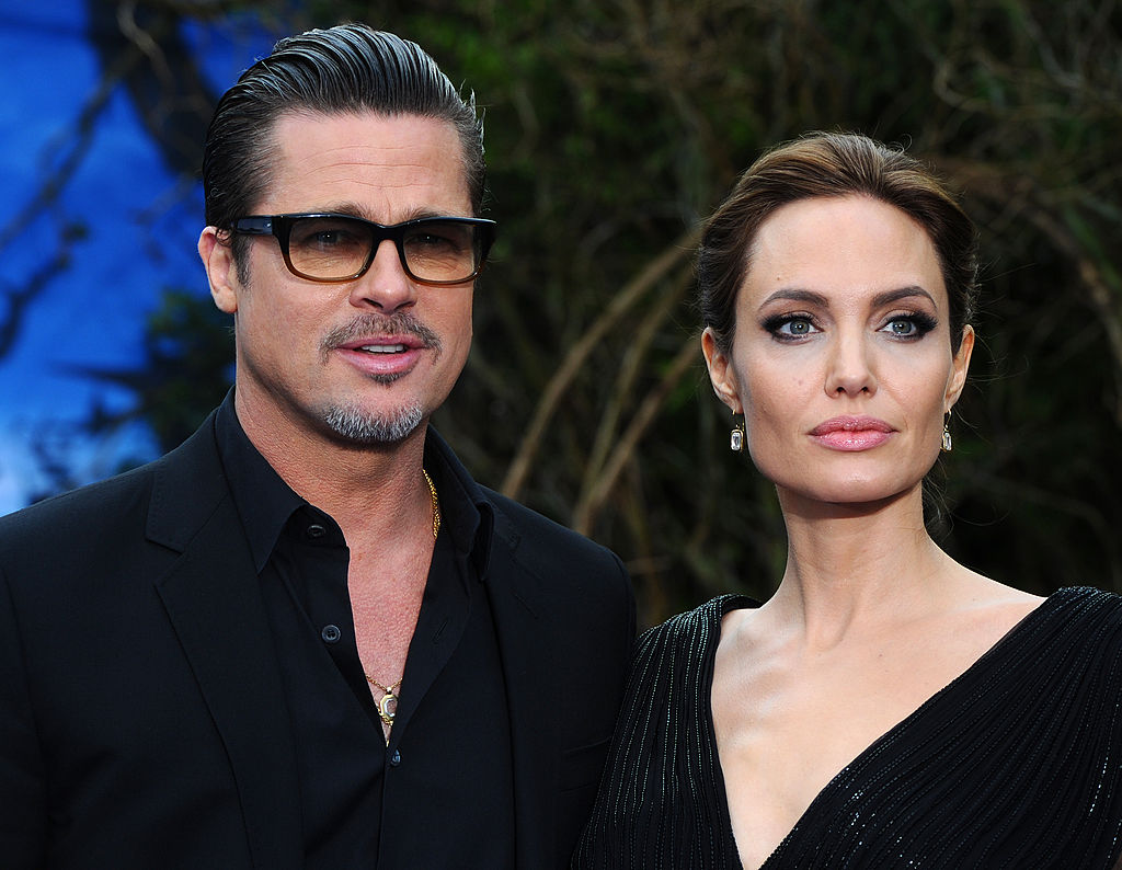LONDON, ENGLAND - MAY 08: Brad Pitt and Angelina Jolie attend a private reception as costumes and props from Disney's "Maleficent" are exhibited in support of Great Ormond Street Hospital at Kensington Palace on May 8, 2014 in London, England. (Photo by Anthony Harvey/Getty Images)