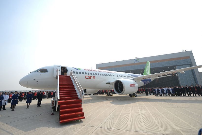 SHANGHAI, CHINA - NOVEMBER 02:  (CHINA OUT) China's first self-developed large passenger jetliner C919 is presented after it rolled off the production line at Shanghai Aircraft Manufacturing Co., Ltd on November 2, 2015 in Shanghai, China. The C919 jet developed by Commercial Aircraft Corporation of China, Ltd. (COMAC) is scheduled to make its maiden flight in 2016..  (Photo by VCG/VCG via Getty Images)