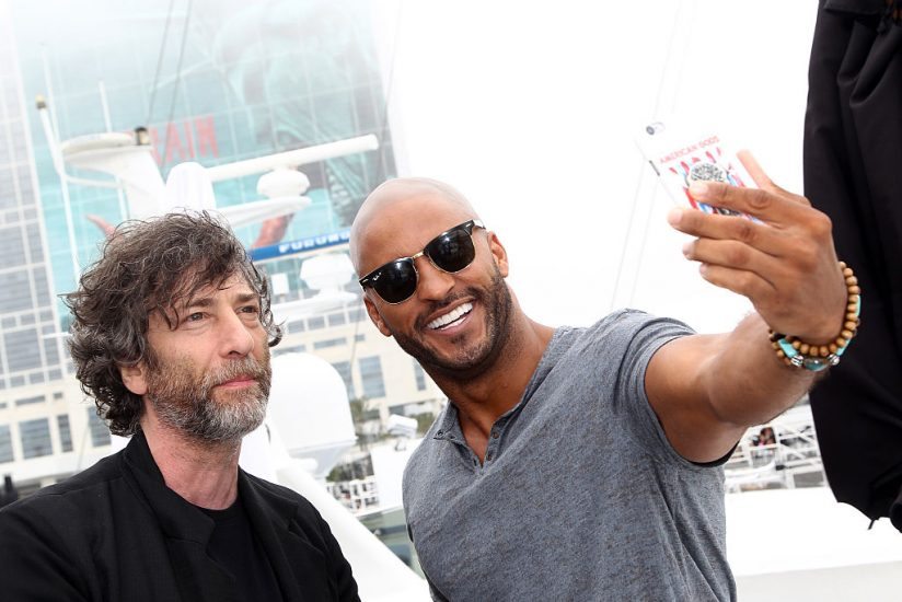 SAN DIEGO, CA - JULY 23: (L-R) Writer Neil Gaiman and actor Ricky Whittle of American Gods attend the IMDb Yacht at San Diego Comic-Con 2016: Day Three at The IMDb Yacht on July 23, 2016 in San Diego, California. (Photo by Tommaso Boddi/Getty Images for IMDb)