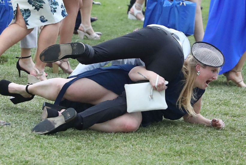 MELBOURNE, AUSTRALIA - NOVEMBER 01: Racegoers trip over each other following 2016 Melbourne Cup Day at Flemington Racecourse on November 1, 2016 in Melbourne, Australia. (Photo by Scott Barbour/Getty Images)