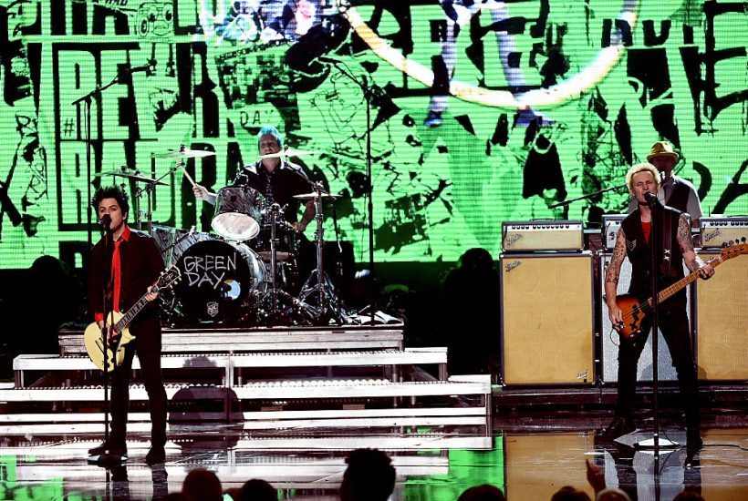 LOS ANGELES, CA - NOVEMBER 20: (L-R) Musicians Billie Joe Armstrong, Tre Cool and Mike Dirnt of Green Day perform onstage during the 2016 American Music Awards at Microsoft Theater on November 20, 2016 in Los Angeles, California. (Photo by Kevin Winter/Getty Images)