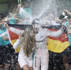ABU DHABI, UNITED ARAB EMIRATES - NOVEMBER 27: Nico Rosberg of Germany and Mercedes GP celebrates with his wife Vivian Sibold and his team after finishing second and securing the F1 World Drivers Championship during the Abu Dhabi Formula One Grand Prix at Yas Marina Circuit on November 27, 2016 in Abu Dhabi, United Arab Emirates. (Photo by Lars Baron/Getty Images)