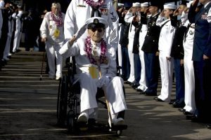 HONOLULU, HI - DECEMBER 07: Military service men and women salute survivors of the attack on Pearl Harbor and their families as they leave a ceremony commemorating the 75th anniversary of the attack at Kilo Pier on December 07, 2016 in Honolulu, Hawaii. (Photo by Kent Nishimura/Getty Images)