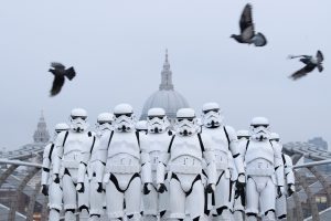 LONDON, ENGLAND - DECEMBER 15: People dressed as Stormtroopers from the Star Wars franchise of films pose on the Millennium Bridge to promote the latest release in the series, "Rogue One", on December 15, 2016 in London, England. "Rogue One: A Star Wars Story" is the first of three standalone spin-off films and is due for released in the UK today. (Photo by Leon Neal/Getty Images)