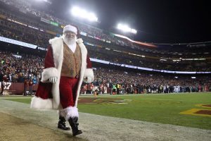 LANDOVER, MD - DECEMBER 19: Santa Claus walks on the sidelines during a game between the Washington Redskins and the Carolina Panthers at FedExField on December 19, 2016 in Landover, Maryland. (Photo by Rob Carr/Getty Images)