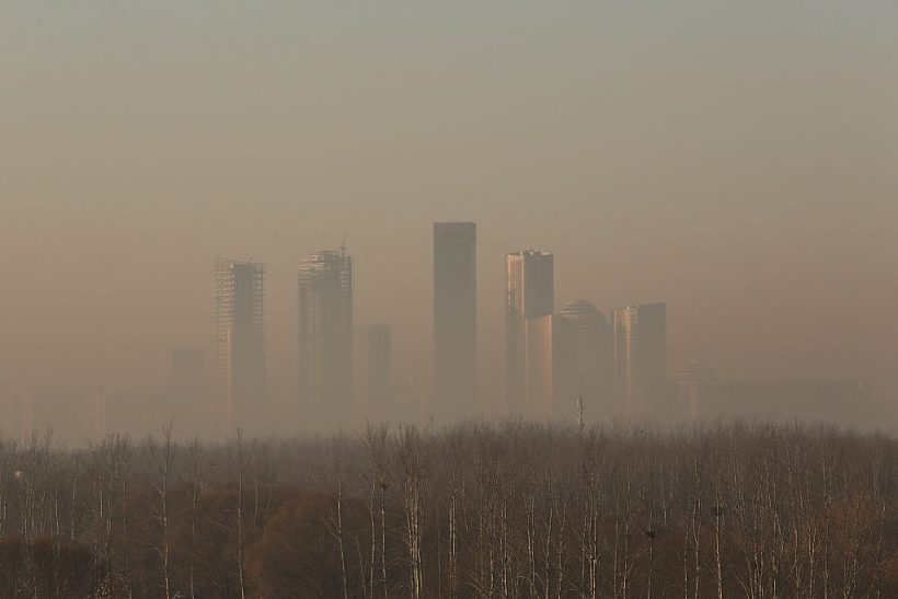 BEIJING, CHINA - DECEMBER 31:  Buildings at central business district are shrouded in heavy smog on December 31, 2016 in Beijing, China. Beijing Meteorological Bureau has issued an orange alert for heavy smog from December 30 to January 1.  (Photo by Lintao Zhang/Getty Images)