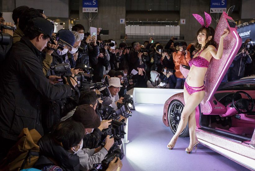 CHIBA, JAPAN - JANUARY 13: A campaign model poses for visitors during the 2017 Tokyo Auto Salon car show on January 13, 2017 in Chiba, Japan. Tokyo Auto Salon 2017 is held from January 13 to 15, 2017. (Photo by Christopher Jue/Getty Images)