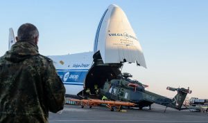 LEIPZIG, GERMANY - JANUARY 27: Technicians load a Bundeswehr NH90 helicopter onto a plane to ship it to German troops serving in Mali on January 27, 2017 in Leipzig, Germany. Approximately 1,000 Bundeswehr troops will serve among the 13,000 international troops in the United Nations-led MINUSMA peacekeeping force. The Bundeswehr is strengthening its presence with four NH90 helicopters and four Tiger attack helicopters. (Photo by Jens Schlueter/Getty Images)