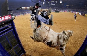 ARLINGTON, TX - FEBRUARY 18: Marco Antonio Eguchi of Brazil gets bucked off of Bottoms Up in the first round of the PBR Frontier Communications Iron Cowboy at AT&T Stadium on February 18, 2017 in Arlington, Texas. (Photo by Tom Pennington/Getty Images)