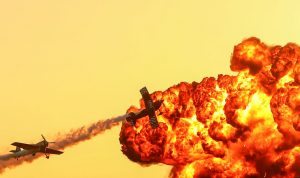 AVALON, AUSTRALIA - MARCH 03: Oris TinStix of Dynamite aerobatic team featuring American Skip Stewart and Triple world aerobatics champion Jurgus Kairys fly past pyrotechnics as they perform at The Australian International Airshow on March 3, 2017 in Avalon, Australia. (Photo by Scott Barbour/Getty Images)