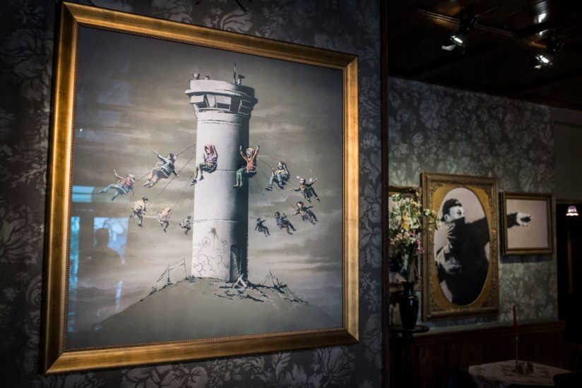 BETHLEHEM, WEST BANK - MARCH 04: A general view inside street artist Banksy's newly opened Walled Off Hotel in the Israeli occupied West Bank town of Bethlehem on March 4, 2017 in Bethlehem, West Bank. Anonymous British street artist Banksy launched a hotel in occupied West Bank and next to Israels controversial separation wall in Bethlehem yesterday. The rooms of the hotel are also filled with the artist's work, much of which being about the conflict. The owners say it will be a functioning hotel along with being part art gallery and part political statement. (Photo by Ilia Yefimovich/Getty Images)