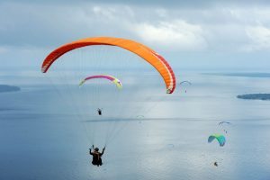 MANADO, INDONESIA - MARCH 17: Paragliders fly during the Paragliding Accuracy World Cup 1st Series 2017 at Mount Tumpa on March 17, 2017 in Manado, Indonesia. (Photo by Robertus Pudyanto/Getty Images)