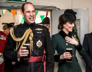 LONDON, ENGLAND - MARCH 17: Prince William, Duke Of Cambridge and Catherine, Duchess of Cambridge take a drink of Guinness as they meet with soldiers of the 1st battalion Irish Guards in their canteen following their St Patricks day parade at Cavalry Barracks on March 17, 2017 in London, England. (Photo by Richard Pohle - WPA Pool/Getty Images)